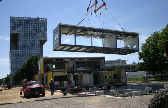 Pre-fabricated buiding units being placed at Cambridge site